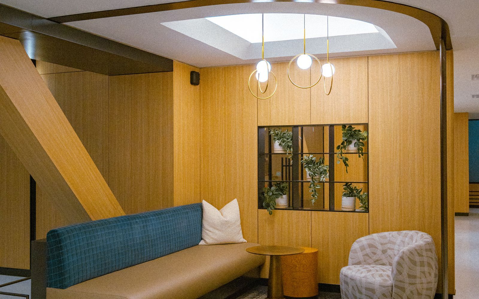 Warm, modern residential building lounge area