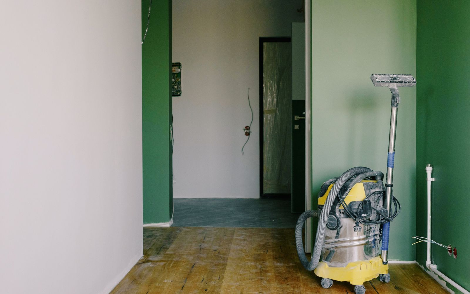 Industrial vacuum staged in a freshly renovated room before final cleaning